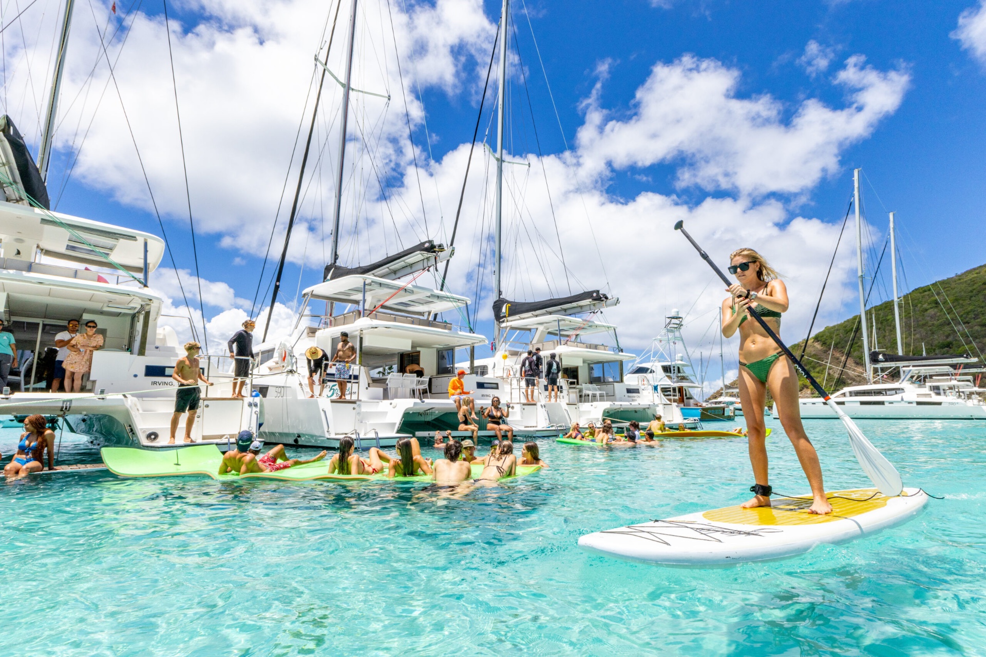 Voyage 590 beach day with paddleboard and swimmers