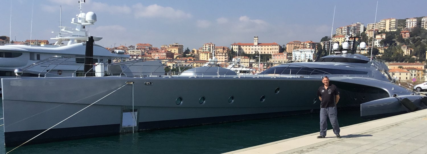 Graham Stimson in front of Blue Coast Yachts Galaxy