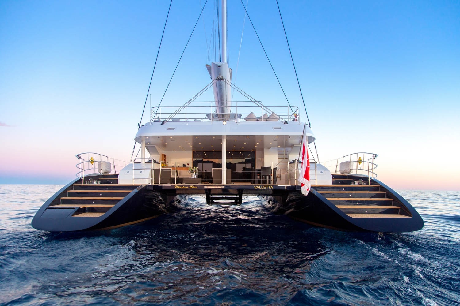 Luxury catamaran at sunset